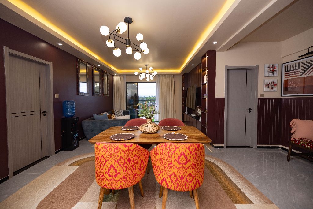 Dining area with statement chandelier, Nairobi family residence
